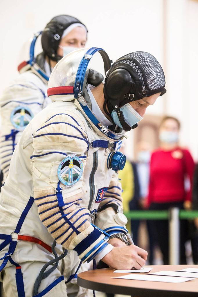 Sergey Ryzhikov of Roscosmos signs in for Soyuz qualification exams