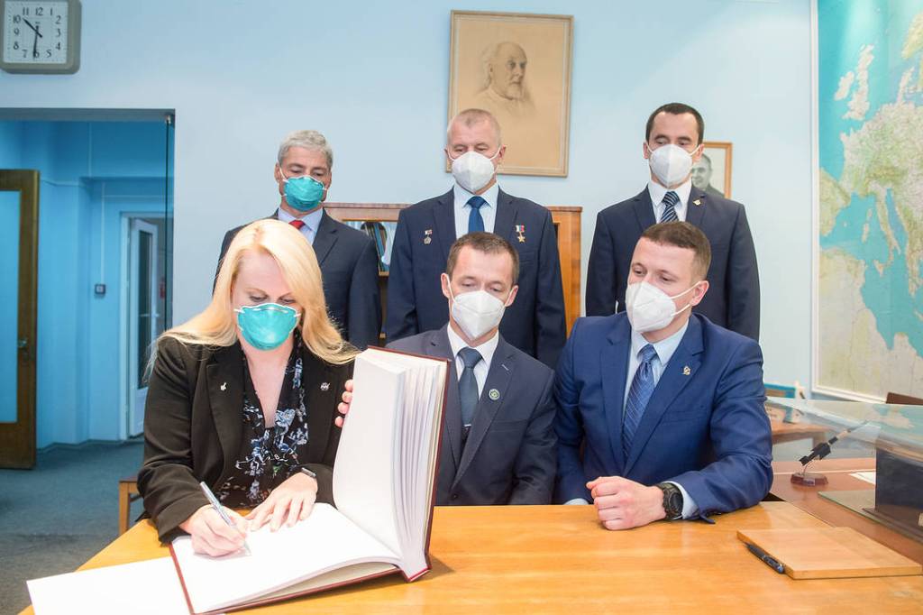 NASA astronaut Kate Rubins signs a guest book