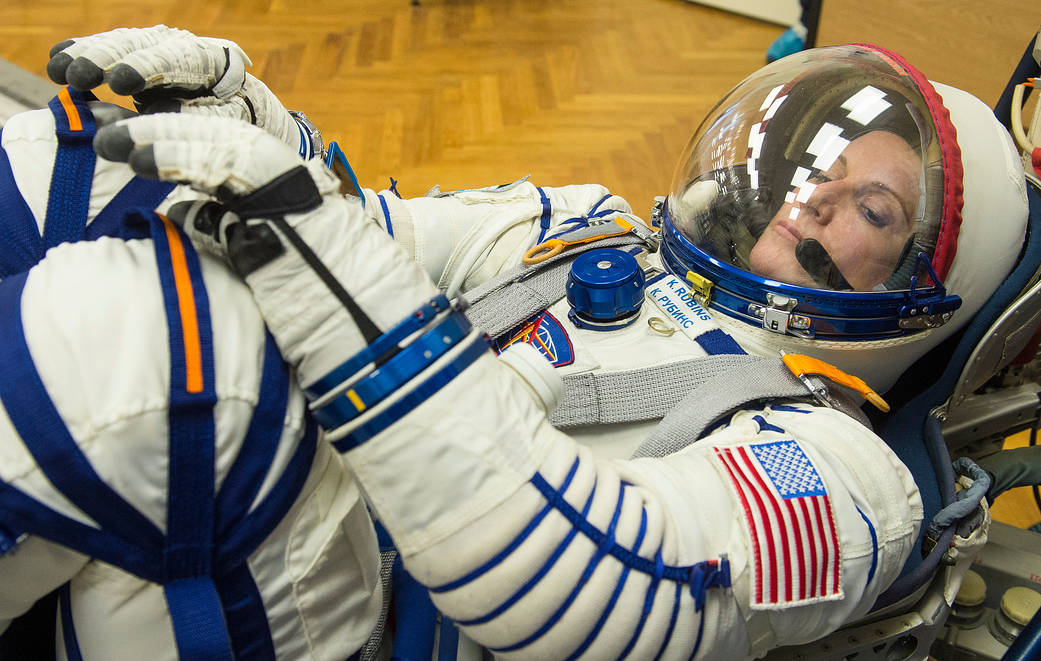 NASA astronaut Kate Rubins having her Sokol suit pressure checked