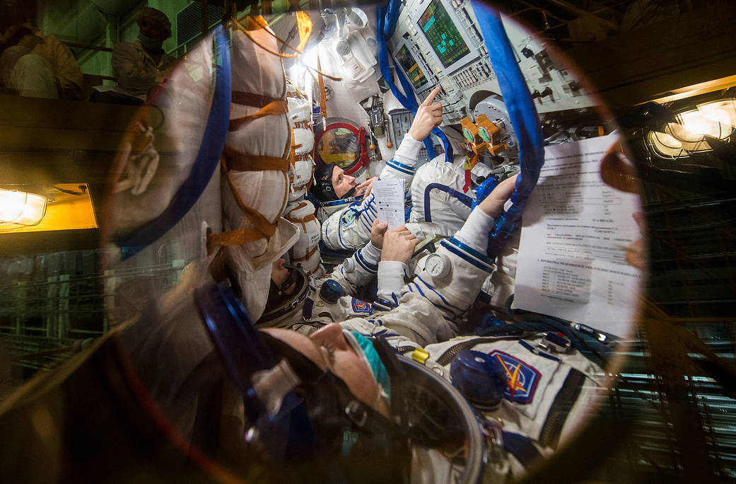Expedition 64 crew members inside the Soyuz MS-17 spacecraft