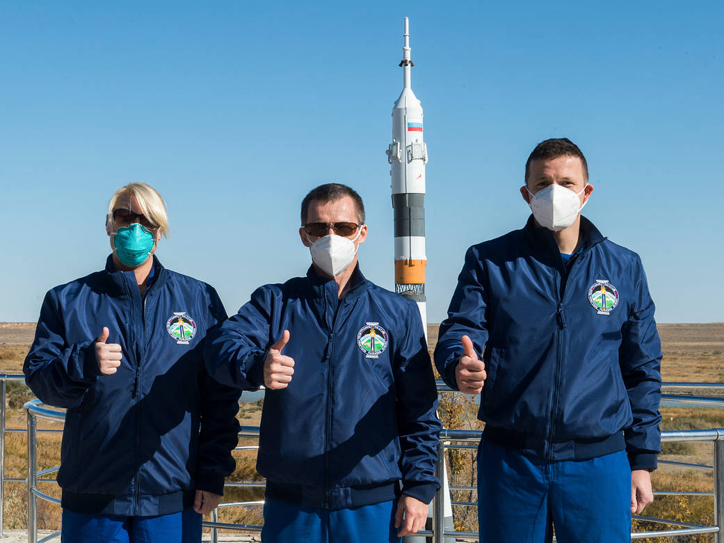 Expedition 64 crew members pose for a picture