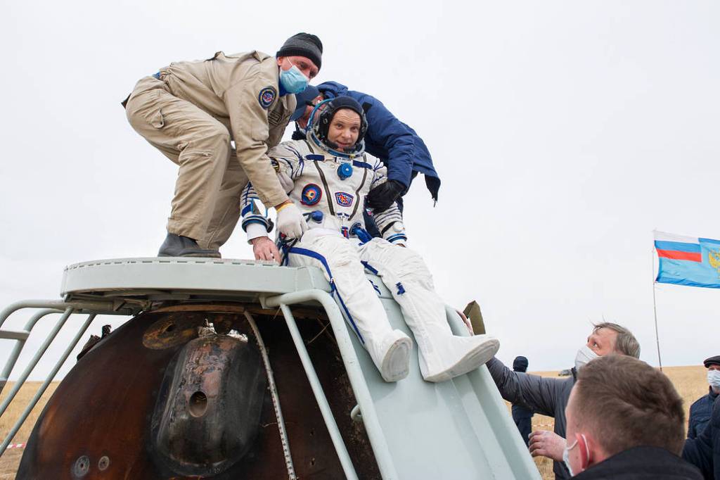 Cosmonaut Ivan Vagner is helped out of the Soyuz MS-16 spacecraft