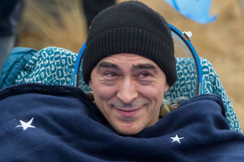 Cosmonaut Anatoly Ivanishin is seen outside the Soyuz MS-16 spacecraft