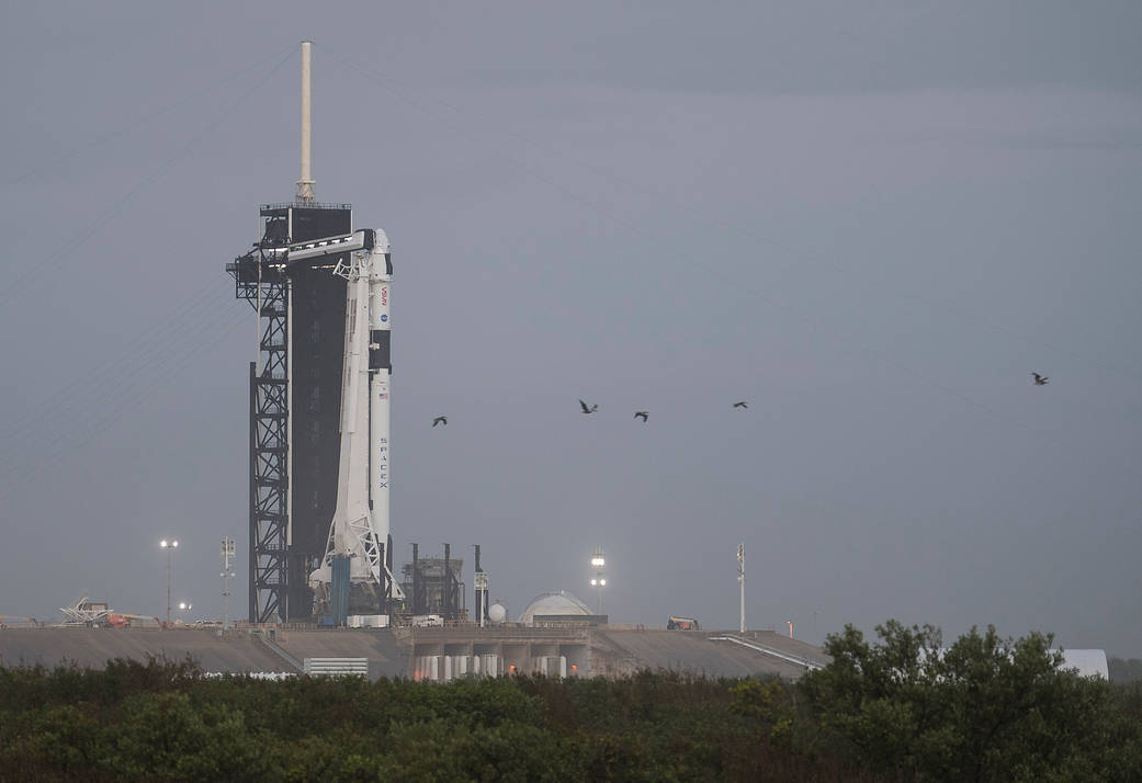 The SpaceX Crew Dragon stands at the launch pad