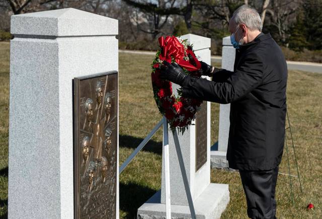 Acting NASA Administrator Steve Jurczyk places a wreath at the Space Shuttle Challenger Memorial 