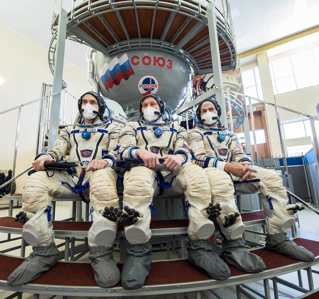Expedition 65 crew members during qualification exams