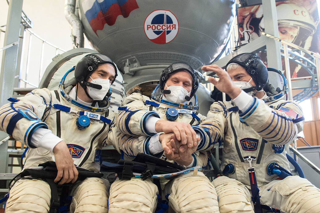 Expedition 65 crew members during qualification exams