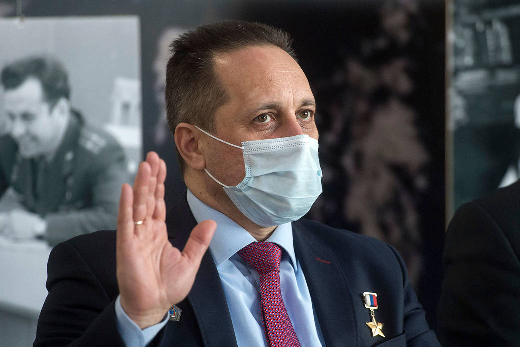Cosmonaut Anton Shkaplerov waves during a press conference