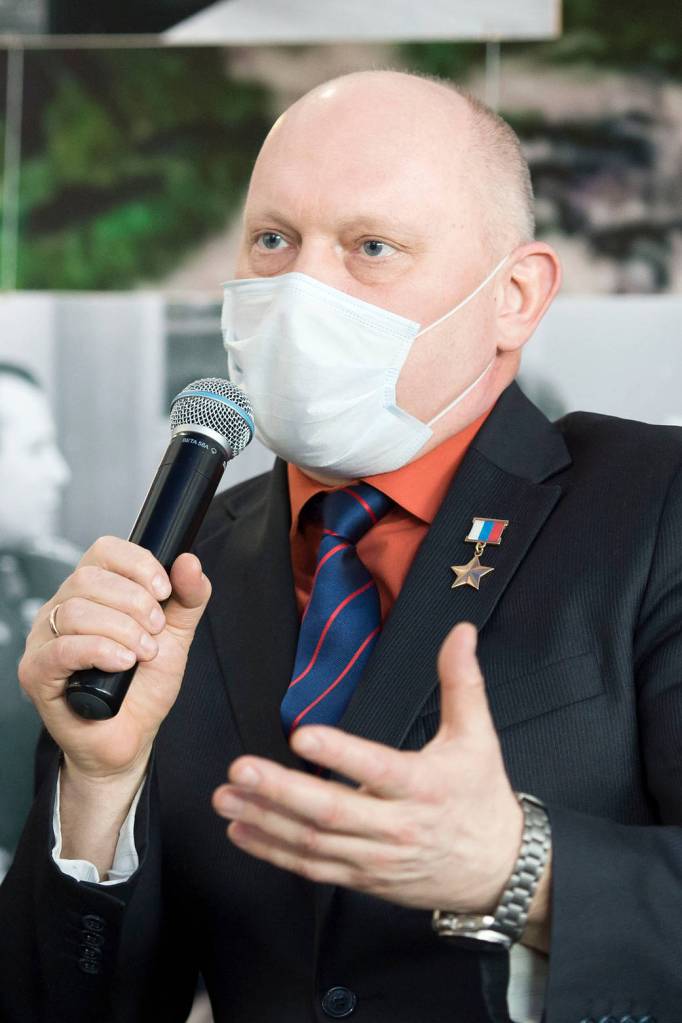 Cosmonaut Oleg Artemyev speaks during a press conference