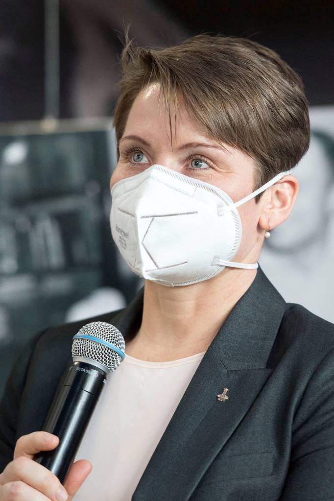 NASA astronaut Anne McClain speaks during a press conference