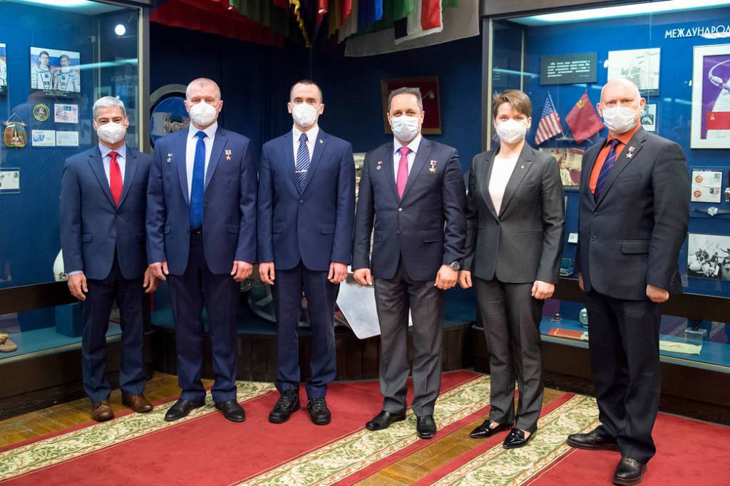 Expedition 65 prime and backup crew members pose for a photo