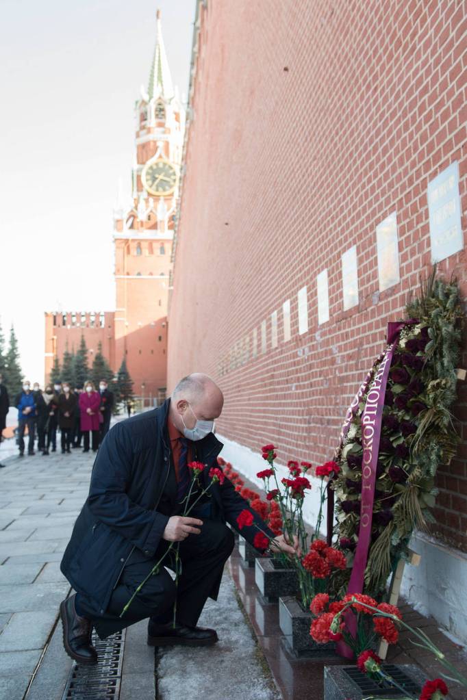 Cosmonaut Oleg Artemyev of Roscosmos lays flowers at Red Square