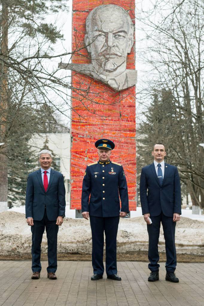 Expedition 65 prime crew members pose for a photo during