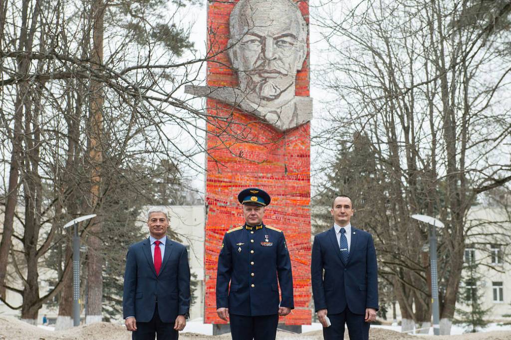 Expedition 65 prime crew members pose for a photo