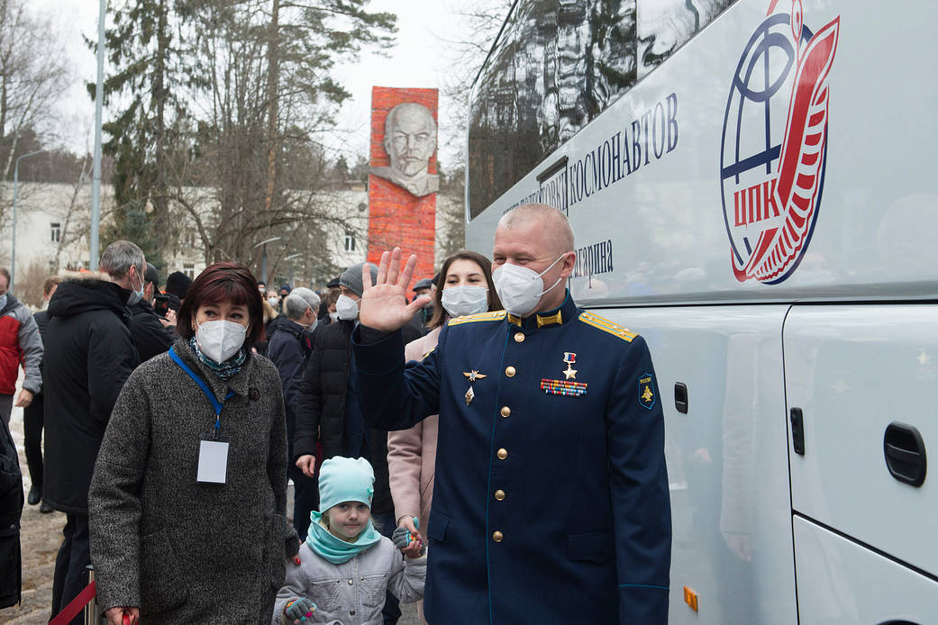 Cosmonaut Oleg Novitskiy waves goodbye during farewell ceremony
