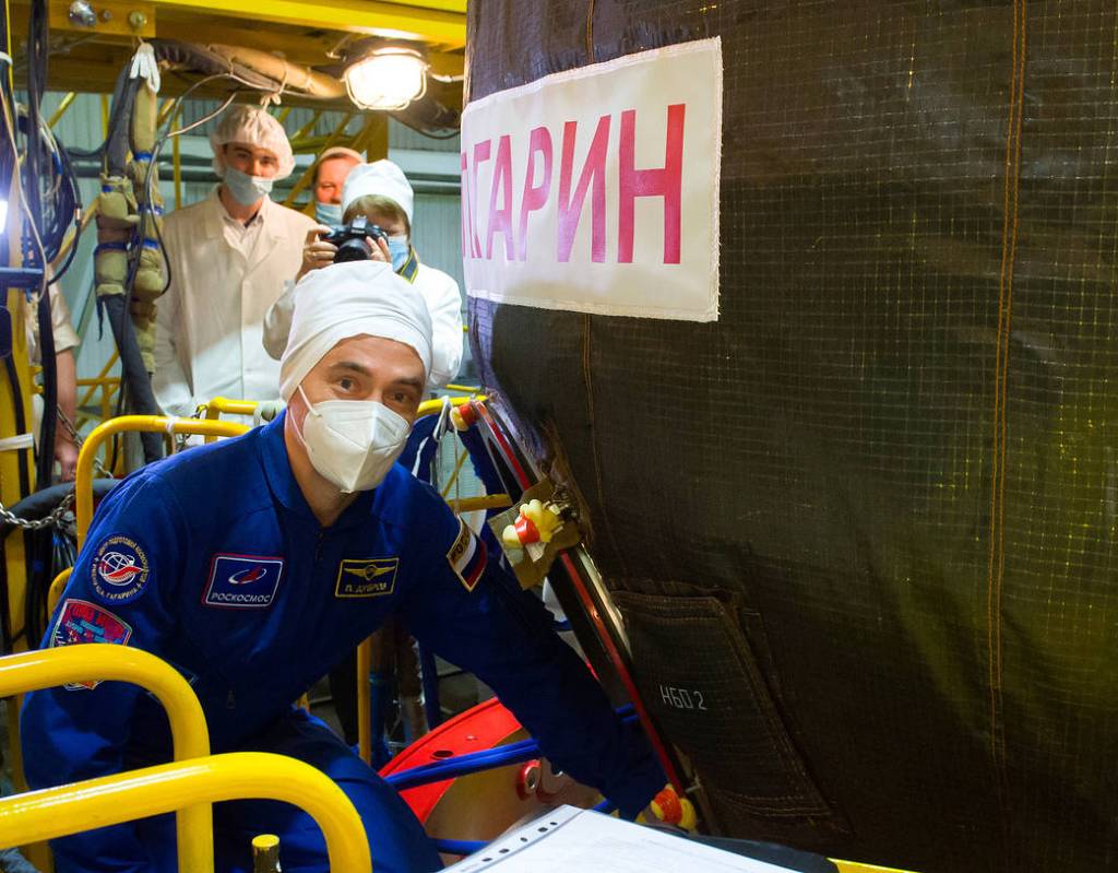 Cosmonaut Pyotr Dubrov is seen heading inside the Soyuz