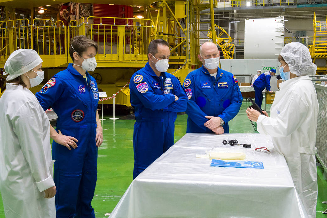 Expedition 65 backup crew members are seen during a fit check