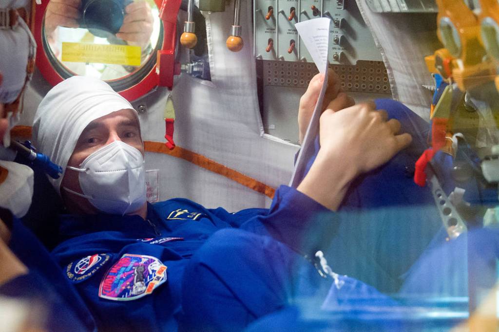 Cosmonaut Pyotr Dubrov of Roscosmos is seen inside the Soyuz