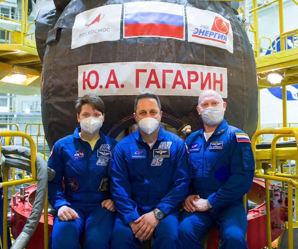 Expedition 65 backup crew members pose for a photo in front of the Soyuz