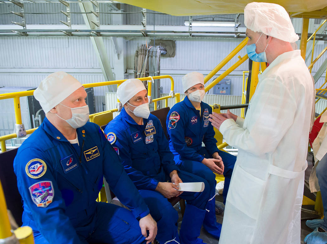 Oleg Artemyev of Roscosmos heads inside the Soyuz