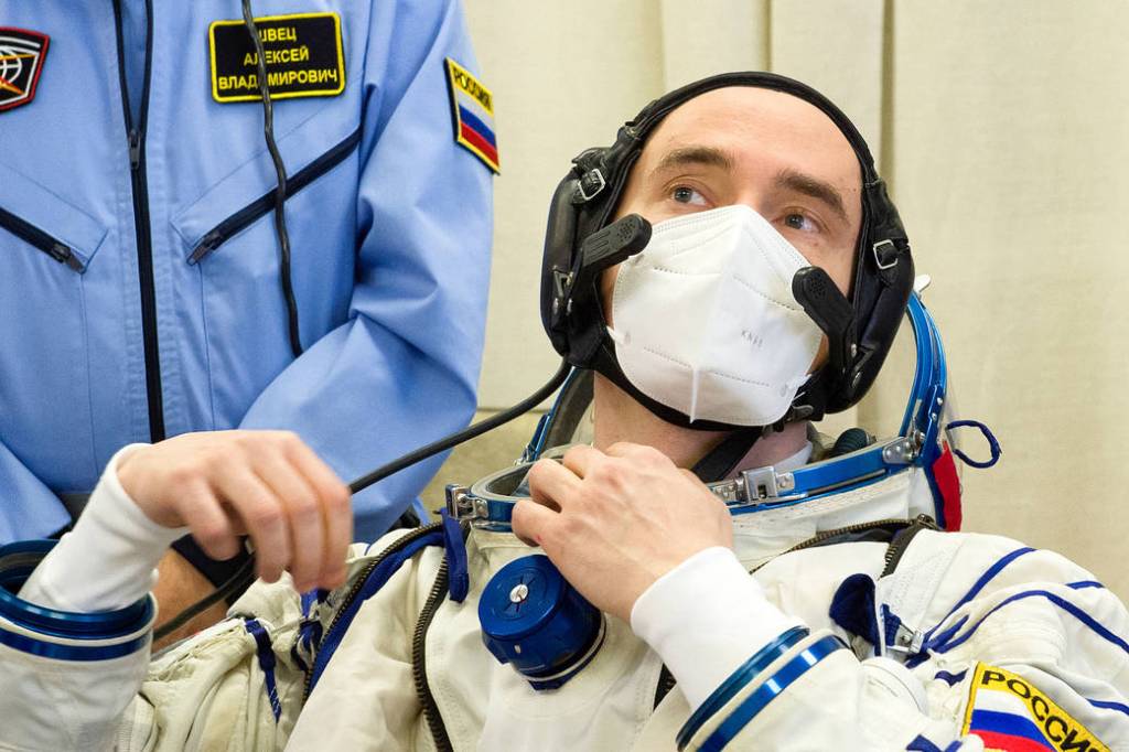Pyotr Dubrov of Roscosmos dons his Sokol suit during the fit check