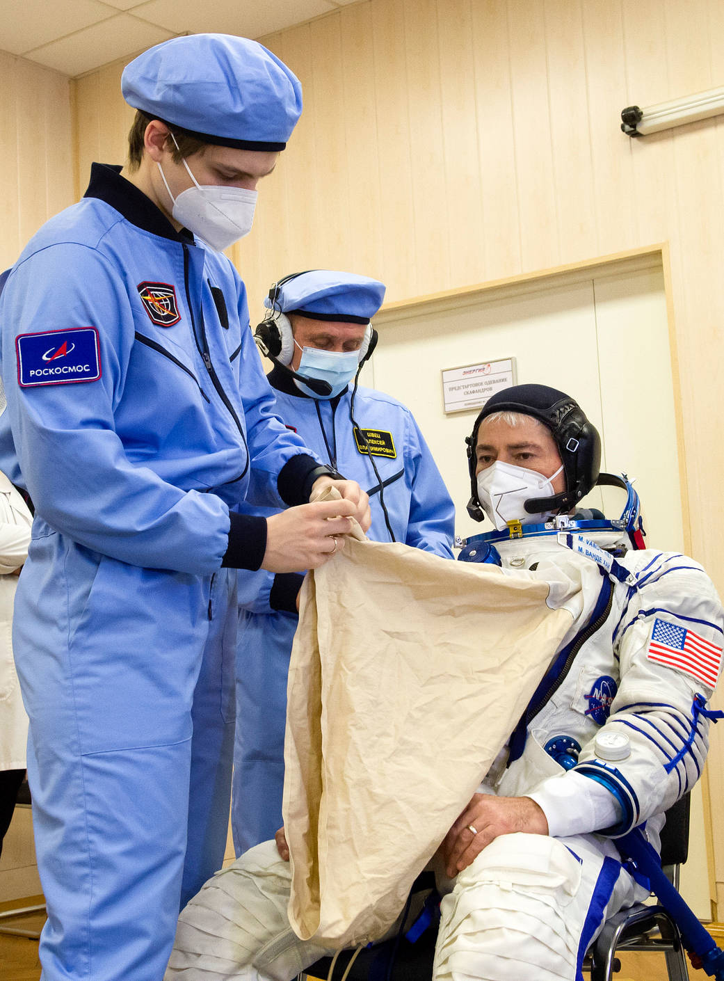 NASA astronaut Mark Vande Hei dons his Sokol Suit during a fit check