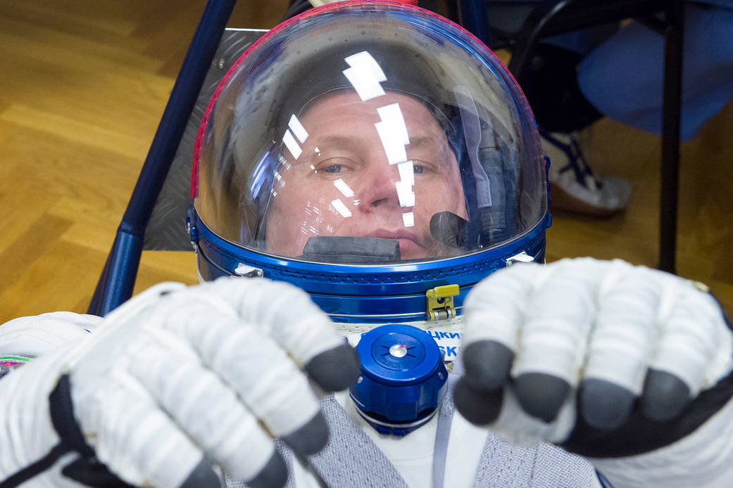 Oleg Novitskiy of Roscosmos has his Sokol suit pressure checked