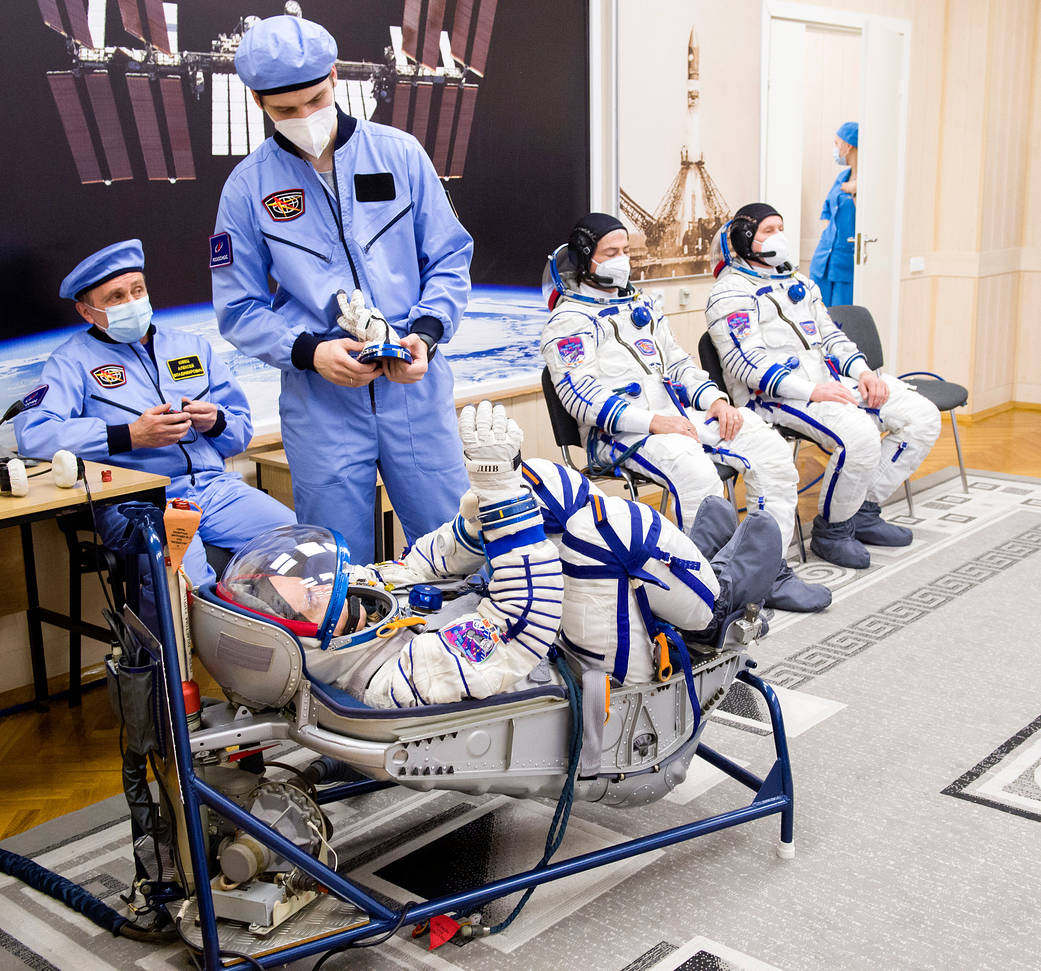 Pyotr Dubrov of Roscosmos has his Sokol suit pressure checked