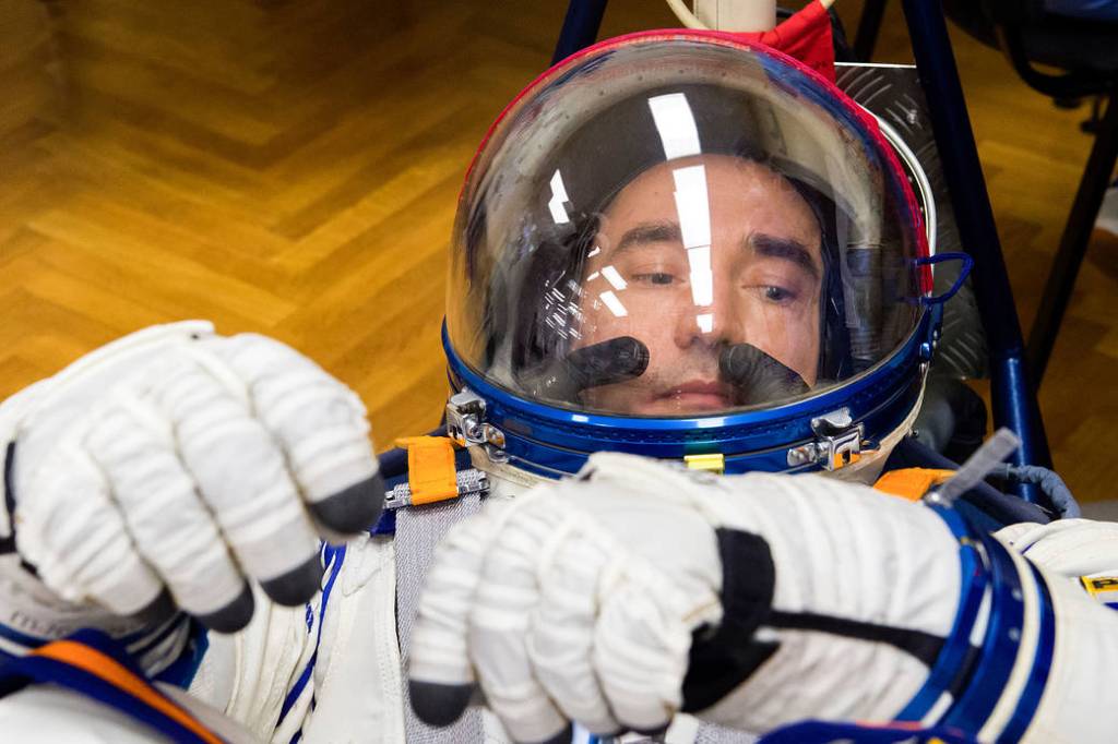 Pyotr Dubrov of Roscosmos has his Sokol suit pressure checked