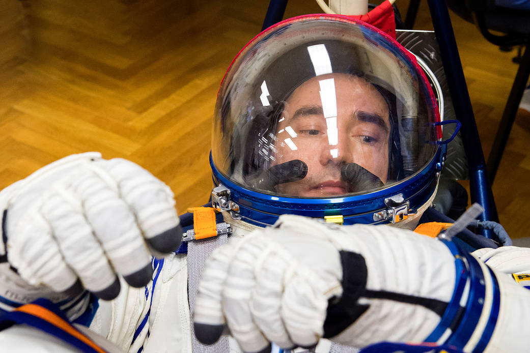 Pyotr Dubrov of Roscosmos has his Sokol suit pressure checked