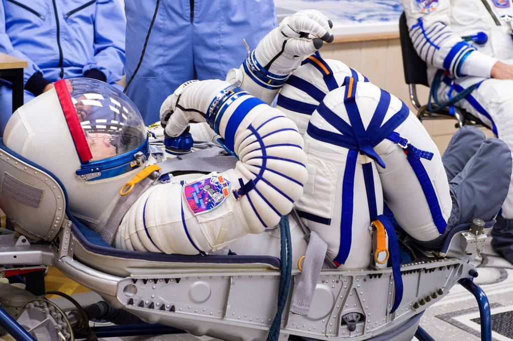 Pyotr Dubrov of Roscosmos has his Sokol suit pressure checked