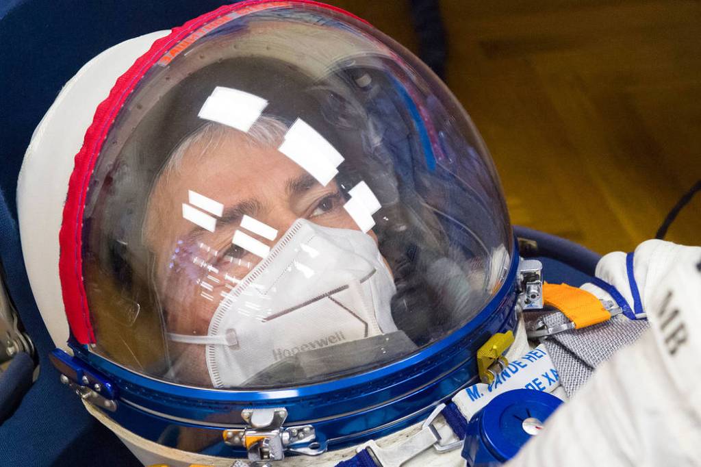 Mark Vande Hei of NASA has his Sokol suit pressure checked