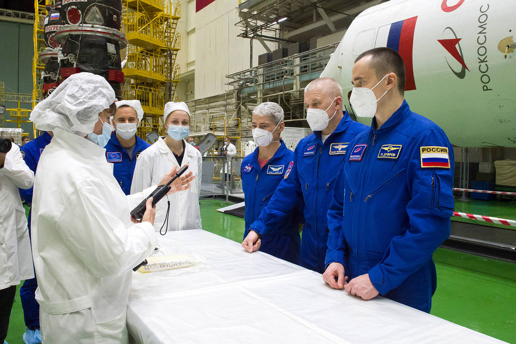 Expedition 65 prime crew members during a fit check