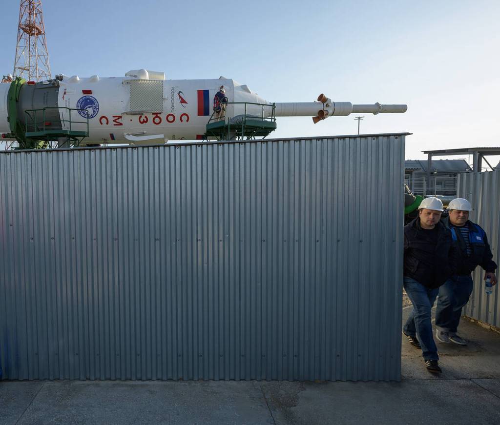 Technicians monitor Soyuz MS-18 rocket roll out
