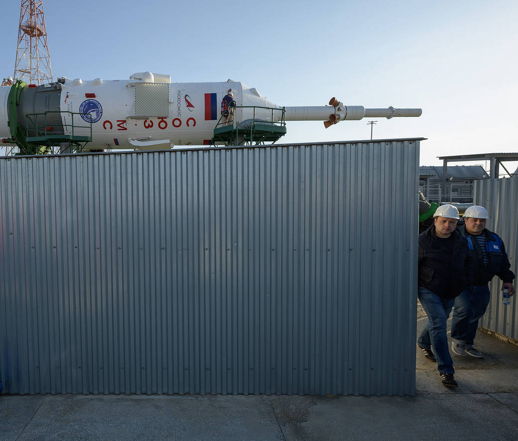 Technicians monitor Soyuz MS-18 rocket roll out