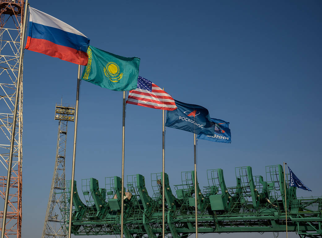 Flags fly at the Baikonur Cosmodrome launch pad