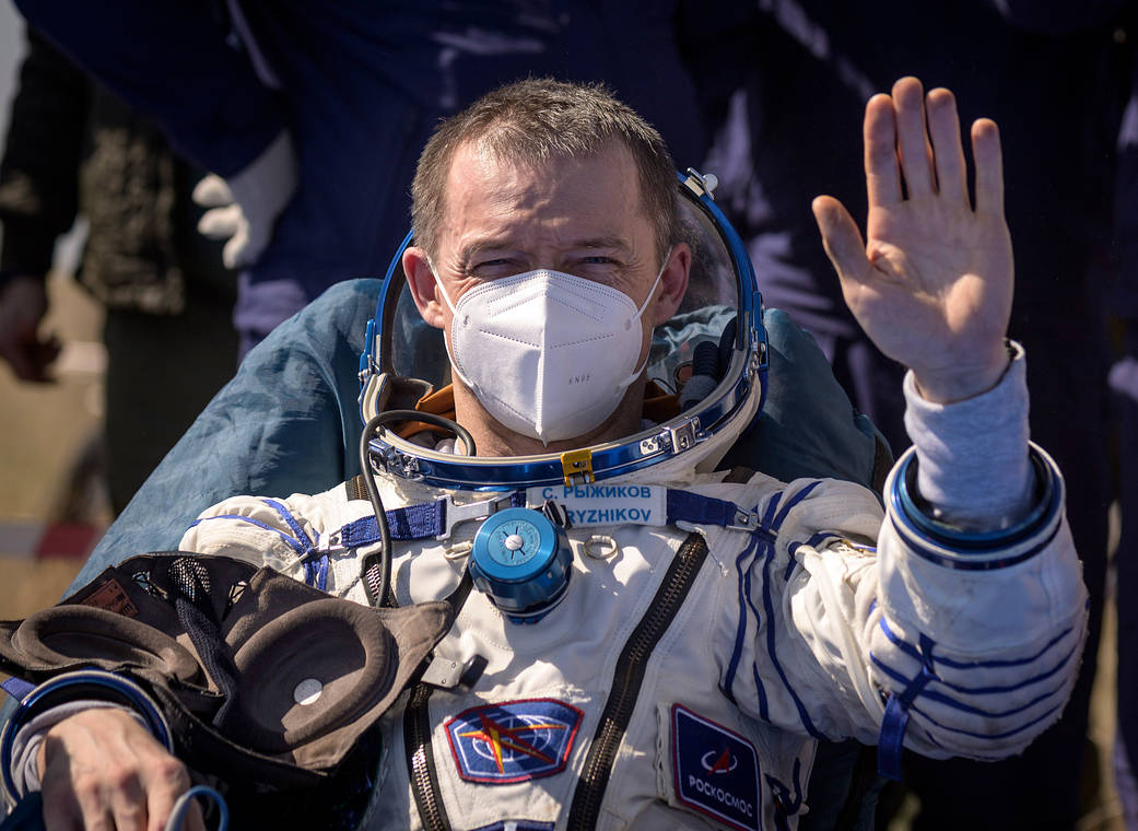 Cosmonaut Sergey Ryzhikov waves after landing on Earth