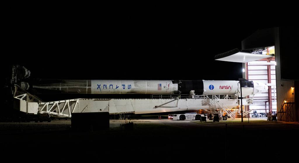 The SpaceX Falcon 9 rocket rolls out to the launch pad