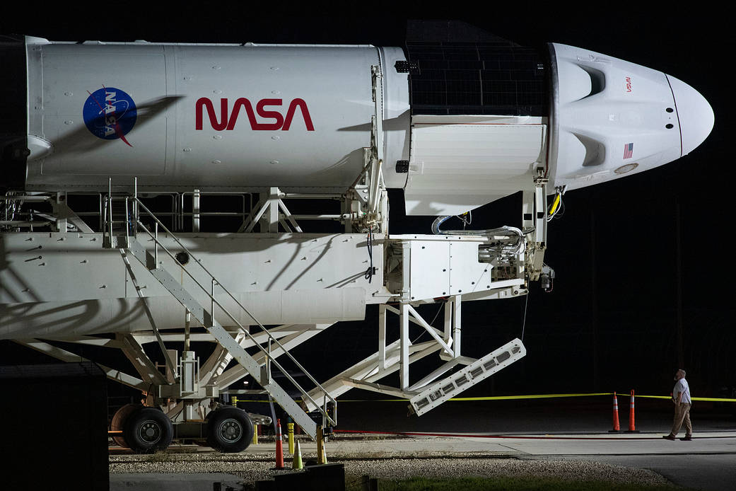 The SpaceX Falcon 9 rocket rolls out to the launch pad