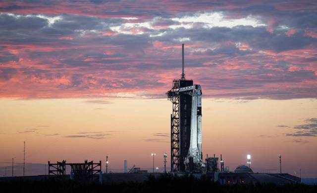A SpaceX Falcon 9 rocket with the company's Crew Dragon spacecraft onboard is seen at sunset on the launch pad at Launch Complex 39A as preparations continue for the Crew-3 mission.
