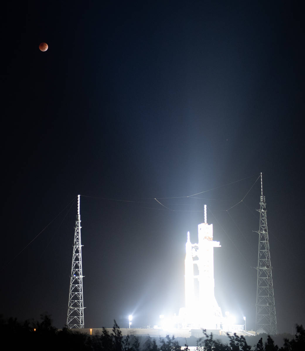 The Moon is seen during a total lunar eclipse above NASA’s Space Launch System (SLS) rocket, Tuesday, Nov. 8, 2022,