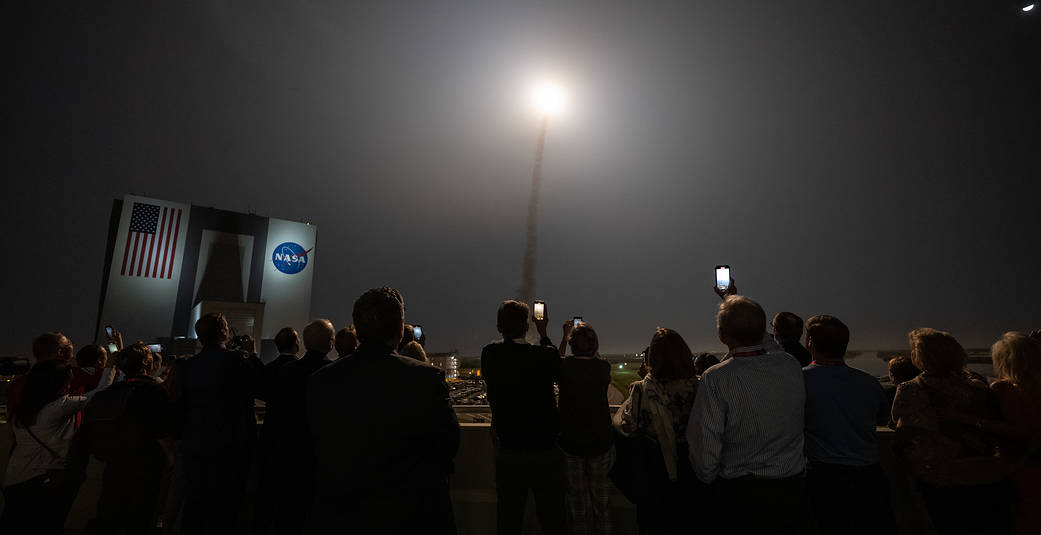 Guests watch the launch of NASA’s Space Launch System rocket carrying the Orion spacecraft on the Artemis I flight test, Wednesday, Nov. 16, 2022.
