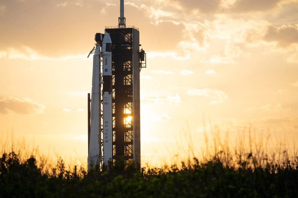 A SpaceX Falcon 9 rocket with the company’s Dragon spacecraft on top during sunset Feb. 23 at Kennedy Space Center’s Launch Complex 39A.