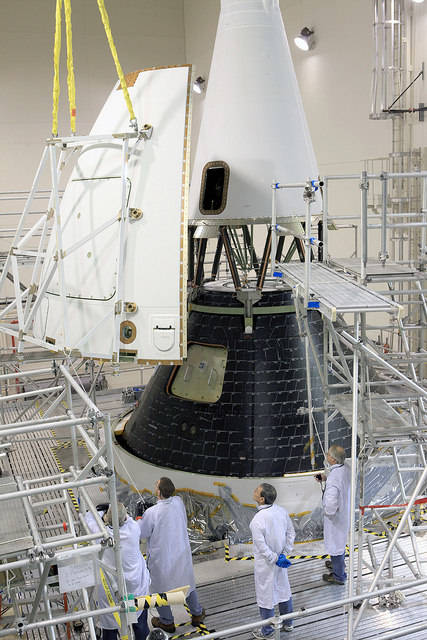 The Orion spacecraft undergoes assembly operations inside the Launch Abort System Facility at Kennedy Space Center.