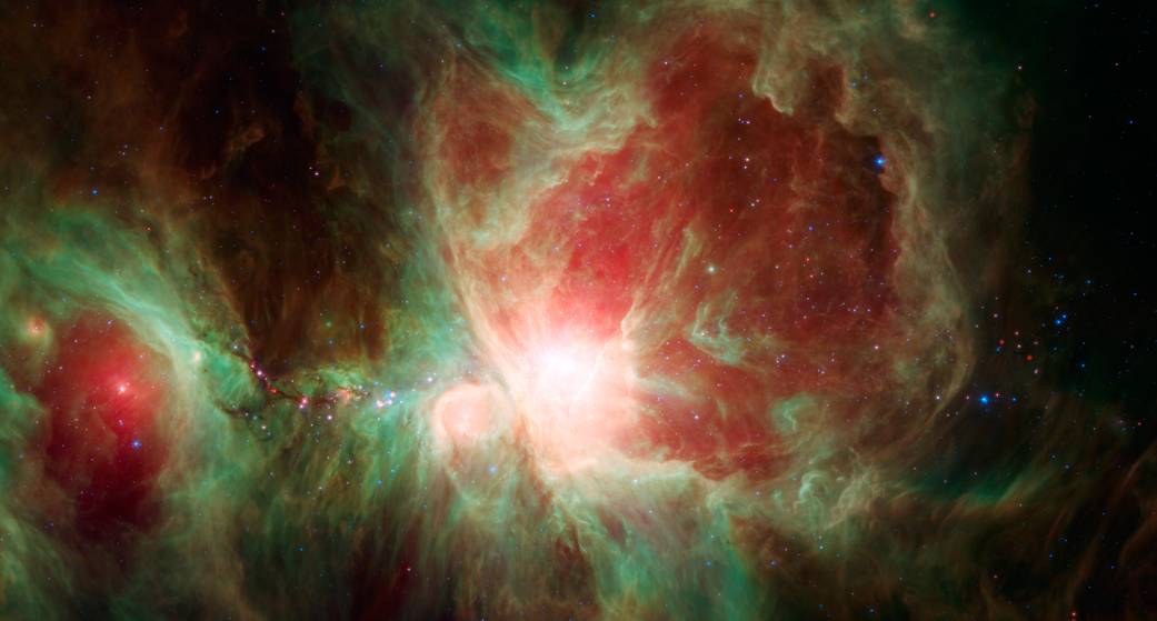 This stunning false-color view spans about 40 light-years across the region, constructed using infrared data from the Spitzer Sp