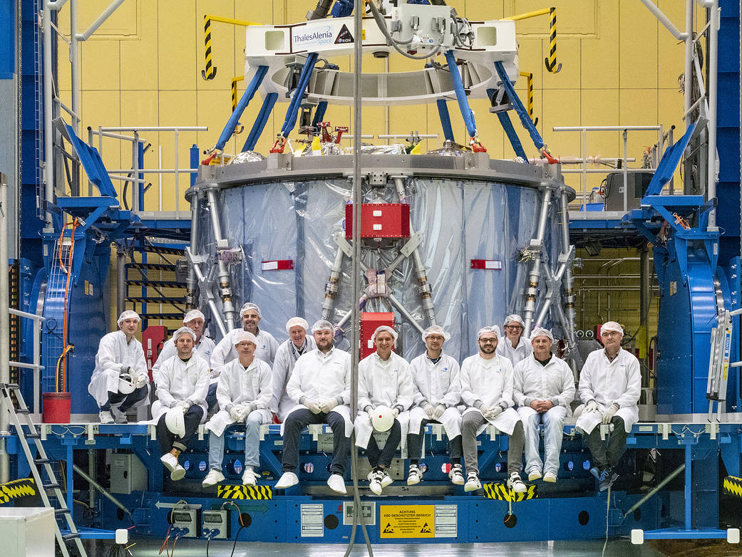 Airbus team poses with the European Service Module during preparations for shipment to KSC