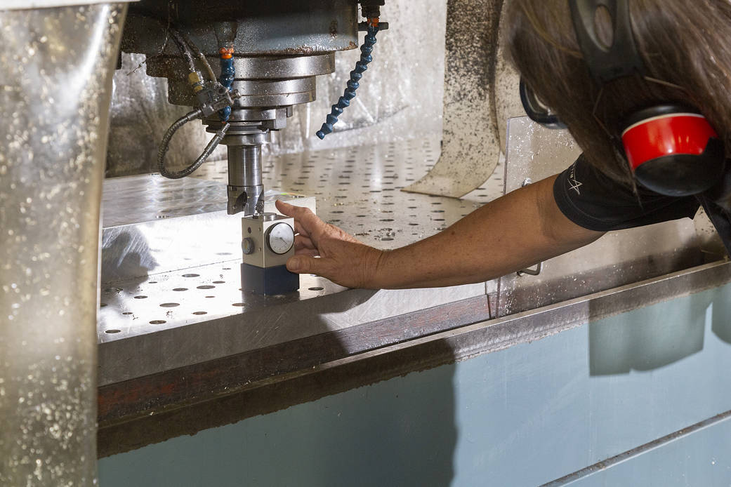 A technician prepares to shave the first piece of the Quesst aircraft.