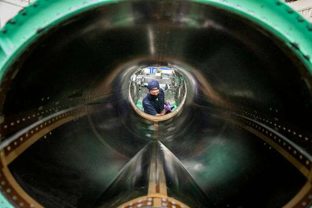 A technician is working on the engine inlet of NASA’s X-59 Quiet Supersonic Technology (QueSST) aircraft at Lockheed Martin’s Skunk Works facility in Palmdale, California. 