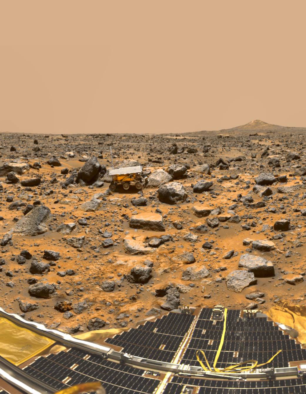 A panoramic view of Pathfinder's Ares Vallis landing site, reveals traces of this warmer, wetter past, showing a floodplain cove