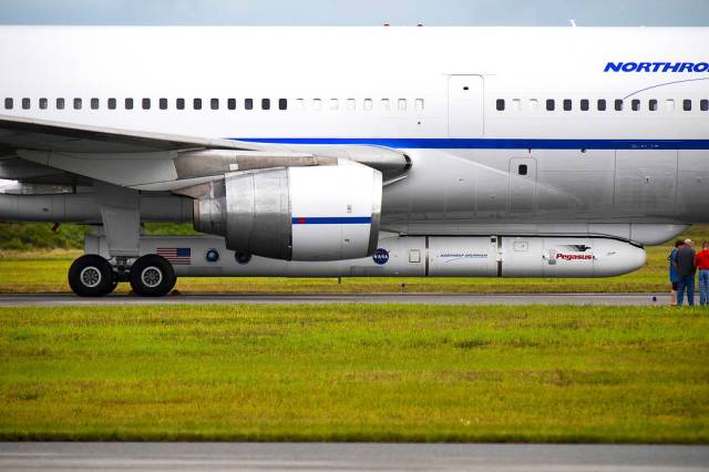 The Stargazer aircraft, with Pegasus XL beneath, containing NASA's ICON, on the Skid Strip at CCAFS in Florida.